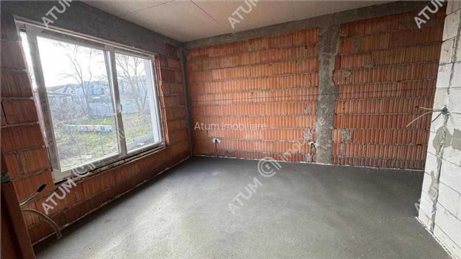 Casa individuala 4 camere 2 bai 120 mp utili 300 mp teren in Sura Mica - 3