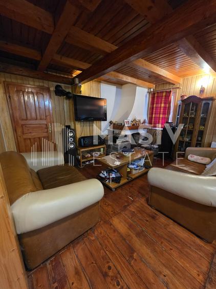 🏡 Casă din lemn masiv cu 7 camere, saună și teren generos – Azuga