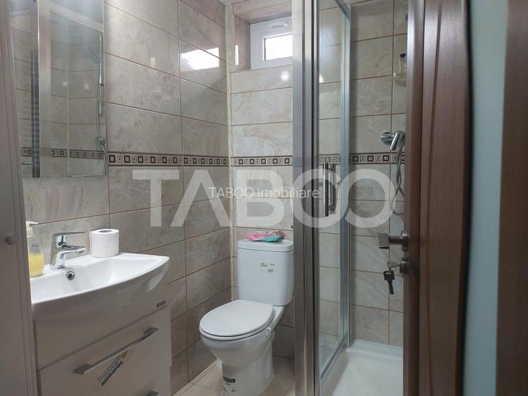 Casa in zona centrala 5 camere 2 bucatarii 3 bai curte comuna Cisnadie