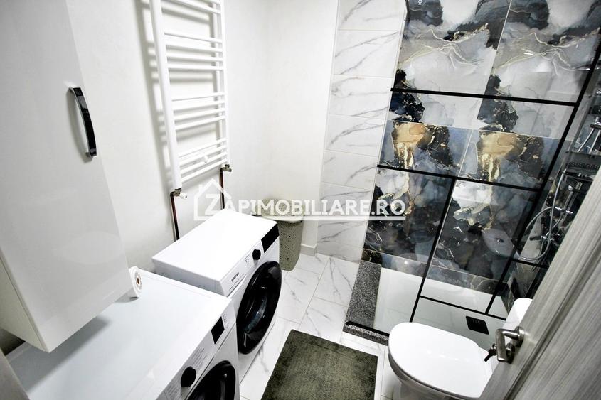 Apartament 1 camera in bloc NOU,46 mp,1 parcare privată
