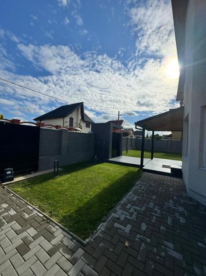 Casă modernă complet renovată, cu curte amenajată și sisteme inteligente