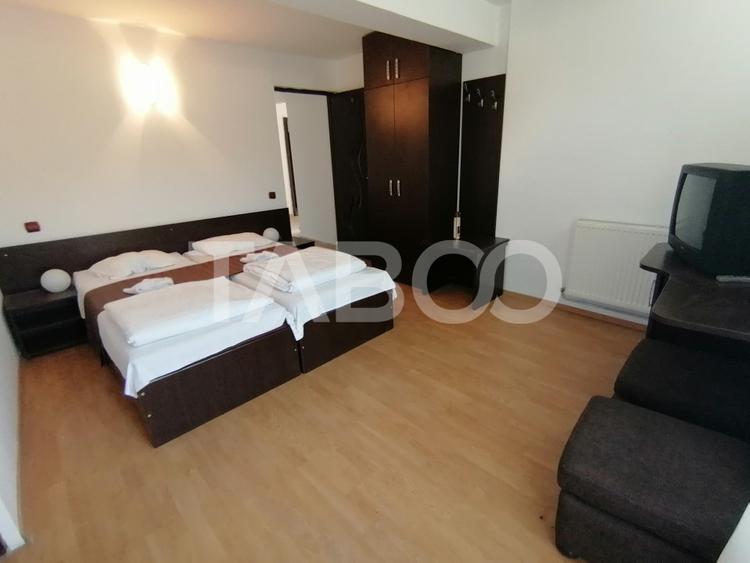 Pensiune 13 camere 16 bai sauna piscina si teren 1565 mp Cisnadioara
