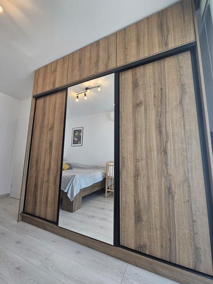 Apartament cu 3 camere, 2 bai si loc de parcare