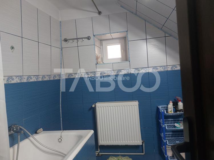 Casa in zona centrala 5 camere 2 bucatarii 3 bai curte comuna Cisnadie