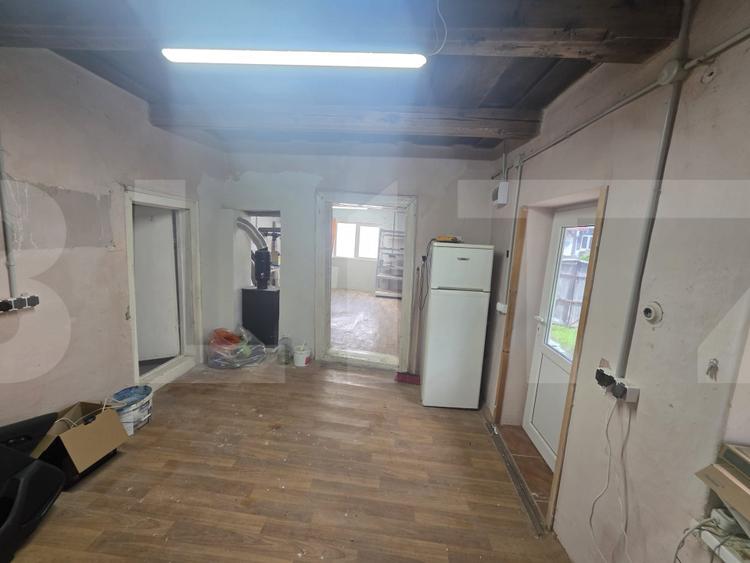 Casă țărănească în centrul localității Ilieni – teren 832 mp.