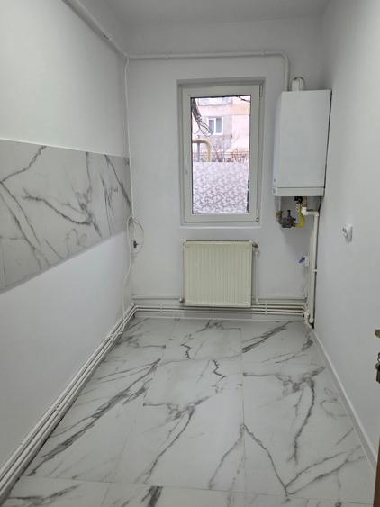 Apartament cu 2 camere parter zona Scoala Generala 2 Adjud- imbunatatit