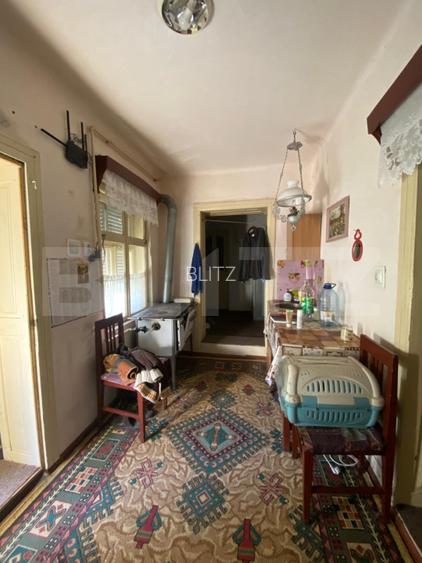 Casă cu teren 10 ari, 2 anexe și dublu front stradal – Beclean
