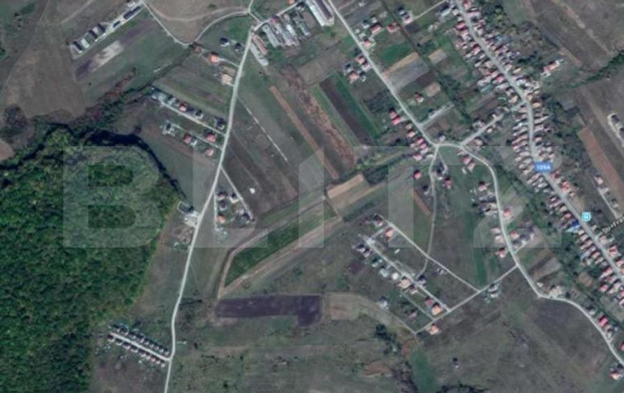 Teren intravilan, 8600 mp, cu doua fronturi stradale, Chinteni