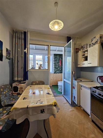 Apartament cu GRADINA SI ACOPERIS MANSARDA DE VANZARE IN ONESTI ETJ 1