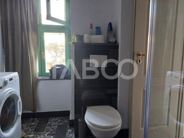 Apartament de vanzare 105 mp 3 camere curte 340 mp in acte Cisnadie