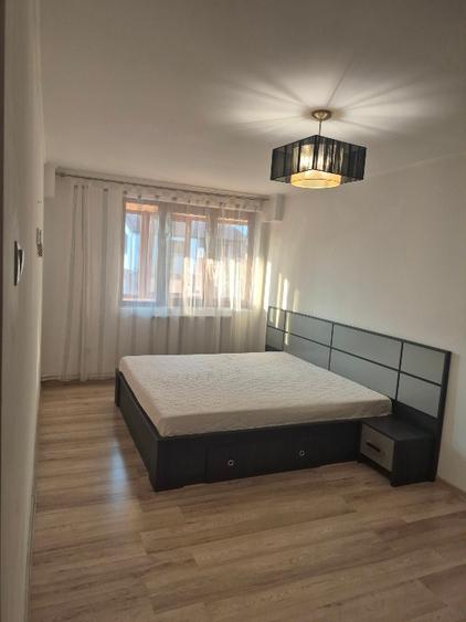 Un apartament cochet, cu parcare proprie, aproape de parcuri si birouri