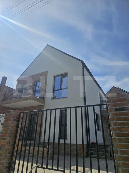 Casa luminoasa de 120 mp, cu living generos, materiale premium si curte proprie