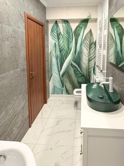 Apartament premium cu grădină proprie și două locuri de parcare.