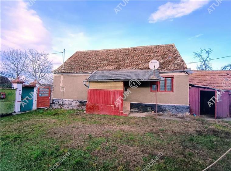 Casa cu 4 camere si 1650 mp teren la doar 30 km distanta de Sibiu