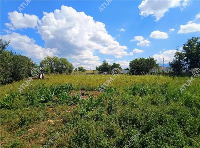 Casa cu 4 camere si 1650 mp teren la doar 30 km distanta de Sibiu