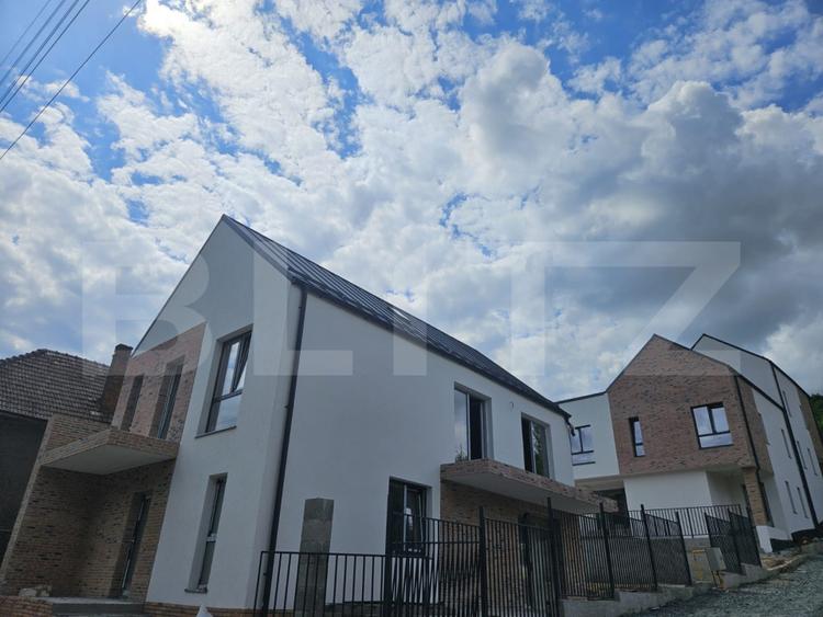 Casa luminoasa de 120 mp, cu living generos, materiale premium si curte proprie