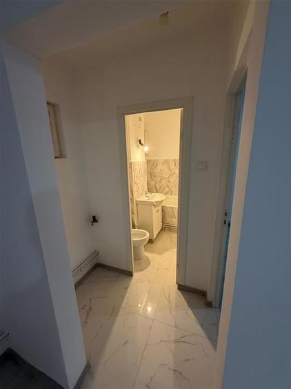 Apartament recent renovat cu centrala proprie parter zona Sagului