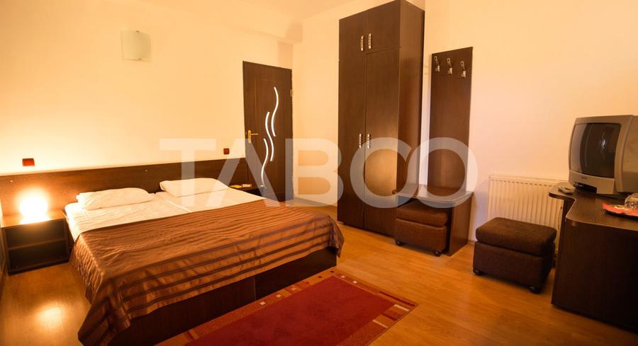 Pensiune 13 camere 16 bai sauna piscina si teren 1565 mp Cisnadioara