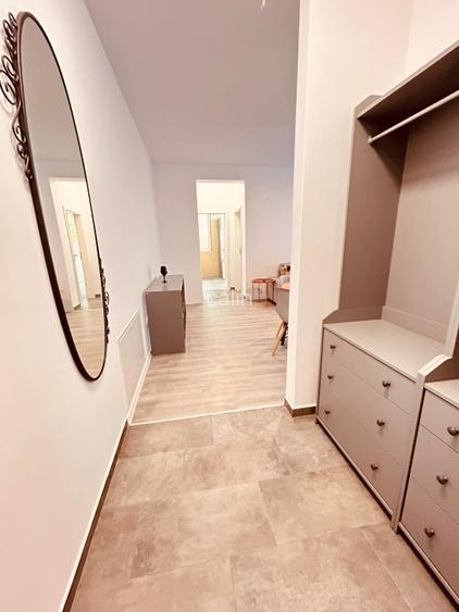 Închiriez apartament 2 camere, cu gradina amenajată in bloc nou.