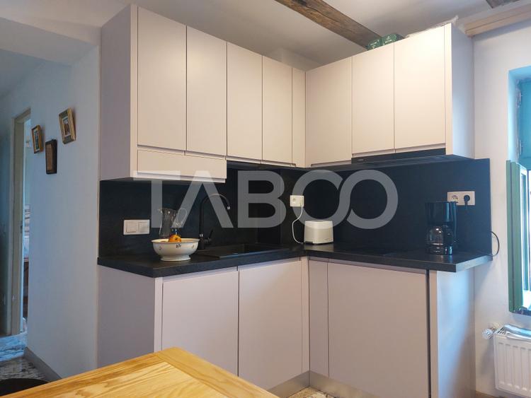 Casa de vanzare 3 camere 2 bucatarii 3 bai teren 340 mp Cisnadie