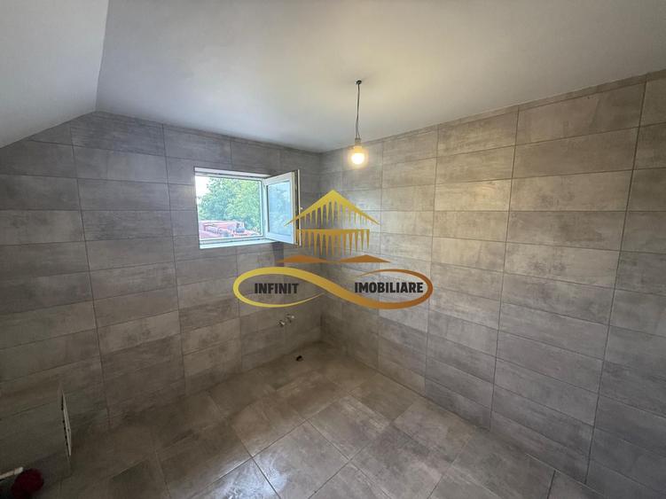 Casa de vanzare in Bacau Saucesti spatioasă cu etaj separat