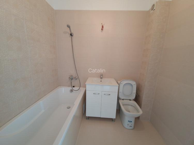 Vând apartament cu 2 camere, decomandat nou  + loc de parcare, situat in complex - 9