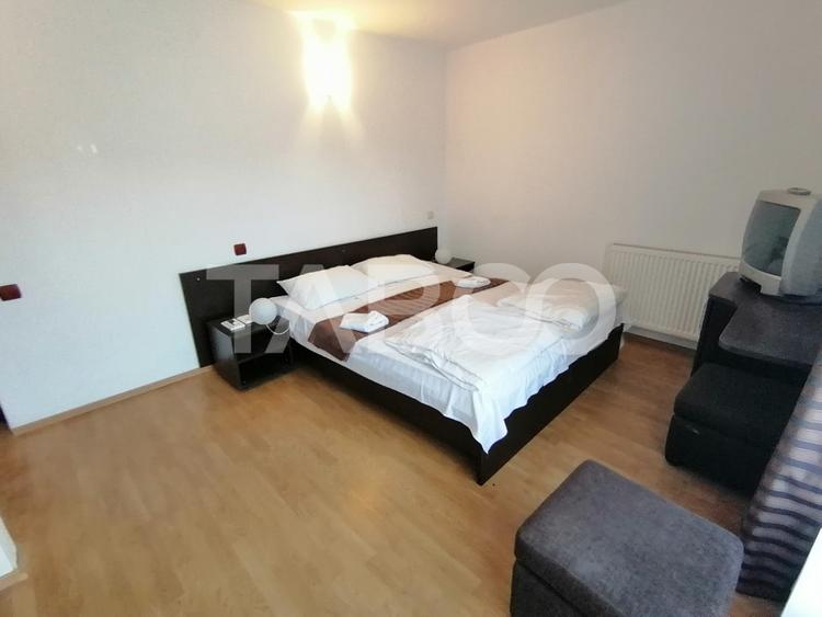 Pensiune 13 camere 16 bai sauna piscina si teren 1565 mp Cisnadioara