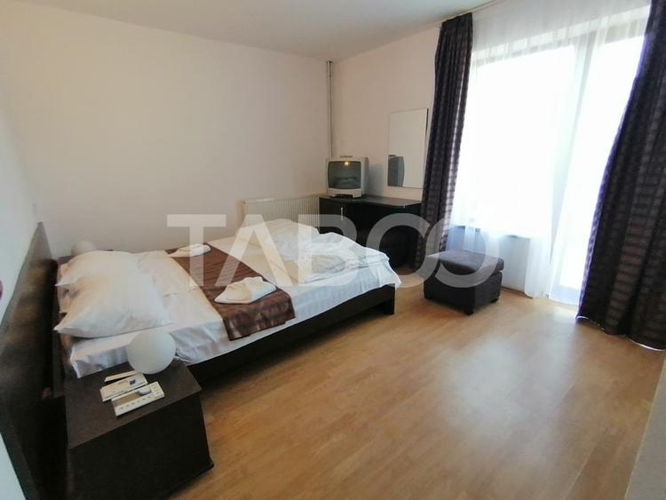 Pensiune 13 camere 16 bai sauna piscina si teren 1565 mp Cisnadioara