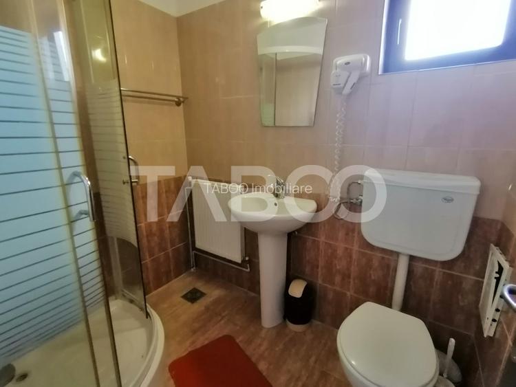Pensiune 13 camere 16 bai sauna piscina si teren 1565 mp Cisnadioara - 11