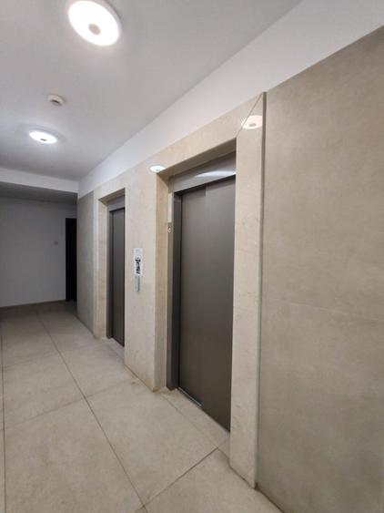 Apartament cu 3 camere, 2 bai si loc de parcare