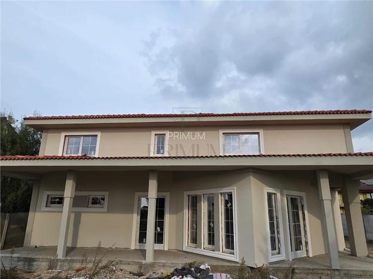 Casa individuala - teren 730 mp - garaj - 5 dormitoare - living 57 mp - 3