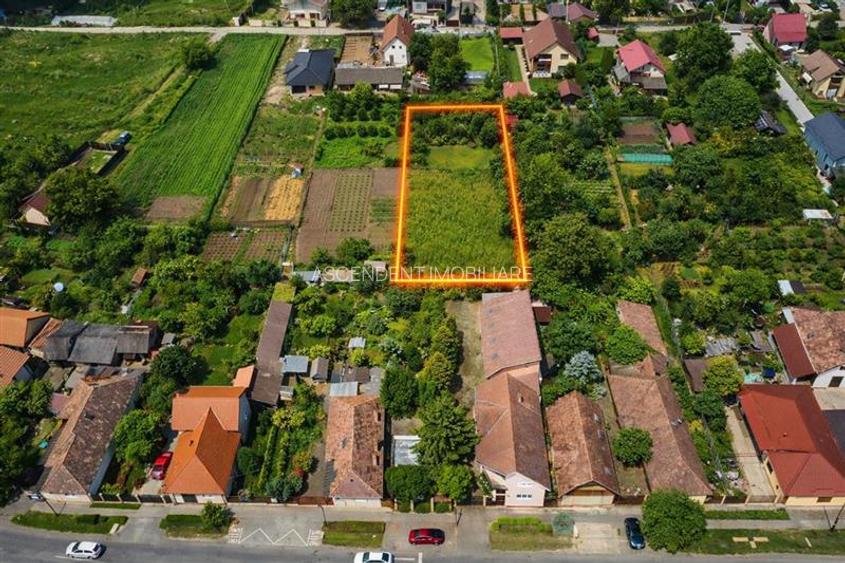 Pretios teren intravilan 1.409 mp, livada, utilitati,rezidential/ comercial, zon - 2