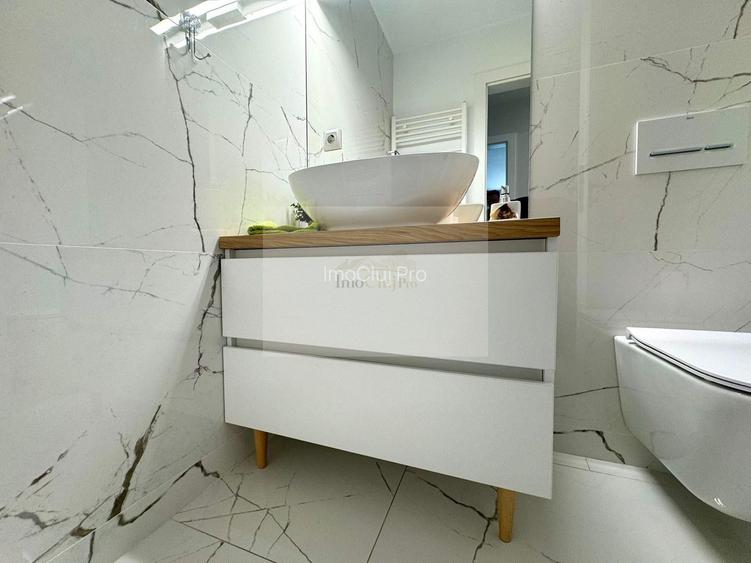 Vânzare  3 camere Grigorescu- -etaj 5/10-2 băi- parcare subter- terasa - 21