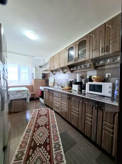 Apartament luminos cu balcon generos, etaj 1 – zona Popăuți