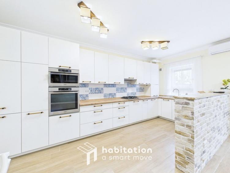Apartament spațios cu curte și garaj – confortul unei case moderne