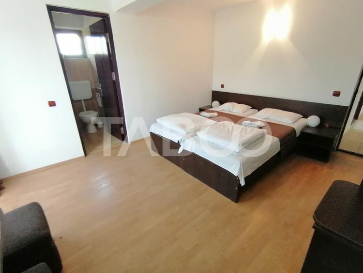 Pensiune 13 camere 16 bai sauna piscina si teren 1565 mp Cisnadioara
