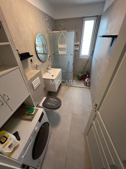 Nou. 57 mp utili.  Mobilat si utilat. Asfalt. Zona Braytim - pozitie excelenta - 12