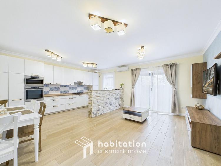 Apartament spațios cu curte și garaj – confortul unei case moderne