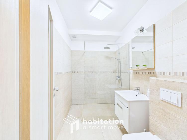Apartament spațios cu curte și garaj – confortul unei case moderne