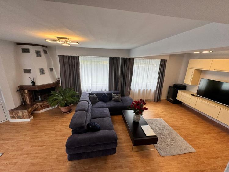 Casă modernă complet renovată, cu curte amenajată și sisteme inteligente