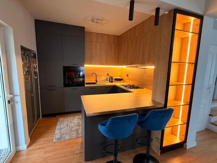 Casă modernă complet renovată, cu curte amenajată și sisteme inteligente