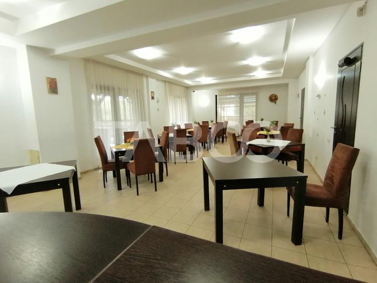 Pensiune 13 camere 16 bai sauna piscina si teren 1565 mp Cisnadioara
