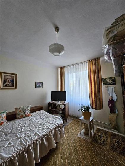 Apartament cu GRADINA SI ACOPERIS MANSARDA DE VANZARE IN ONESTI ETJ 1