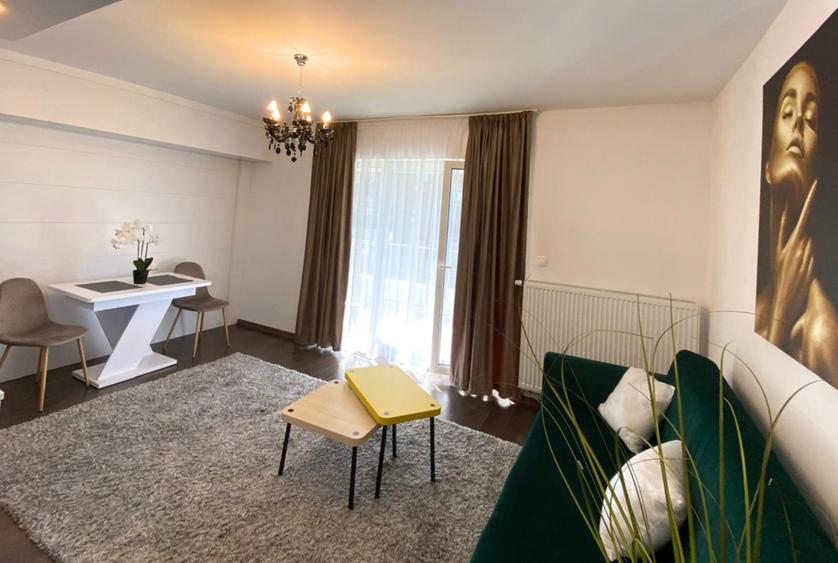 Apartament modern cu 2 camere pereți retractabili terasă parcare și boxă