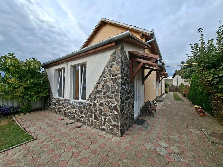 Casa cu etaj 113 mp utili curte libera 350mp garaj cu pod Gusterita