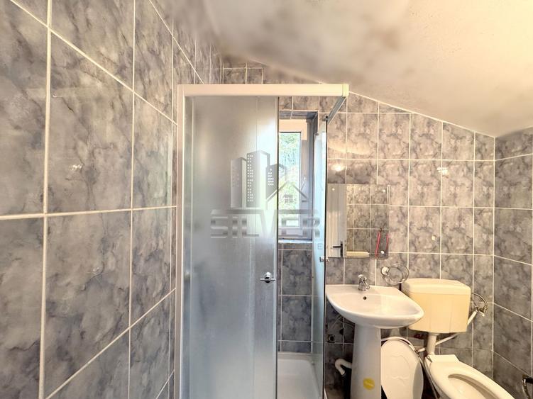 Apartament peste garaj/terasa/curte/parcari.