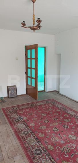 Casa cu 3 camere, bucatarie si baie, 105 mp și un teren de 1900 mp