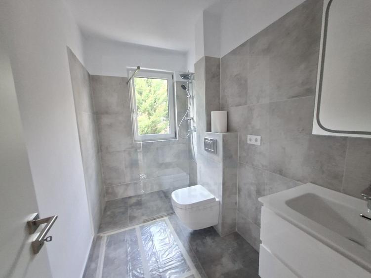 Apartament premium 61.4 mp utili 3 camere 2 bai etaj 1 in Cristian