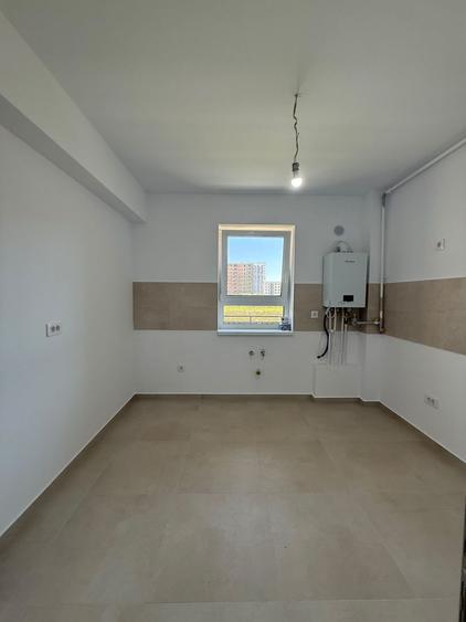 Garsonieră în clădire cu 3 etaje