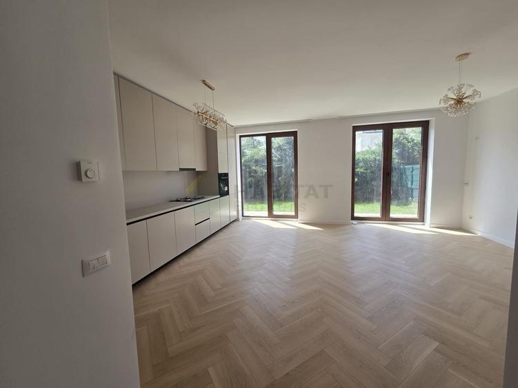 Duplex finalizat in complex stil brâncovenesc, cu grădină proprie